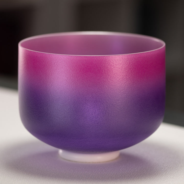 A purple frosted crystal singing bowl with a white base, part of the 'Blossoming Heart Trio' set.
