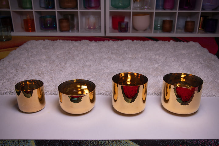 A set of four 24K gold crystal singing bowls from Sacred Singing Bowls