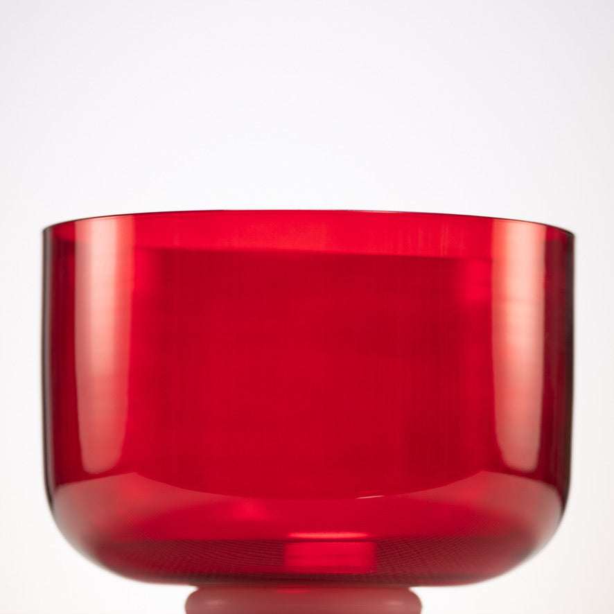 Red crystal singing bowl on a white background