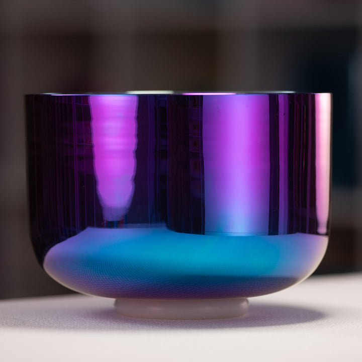 Gradient-colored bowl with purple on top and blue on bottom on a dark background
