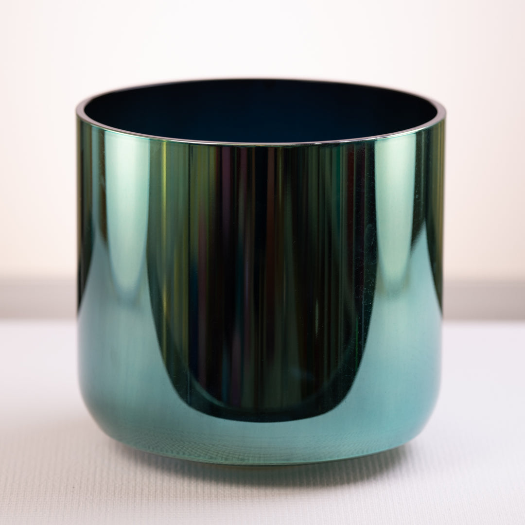 A 10.25-inch E+27 Earth Magic singing bowl with a black interior and a reflective green to blue gradient exterior, placed on a flat surface.
