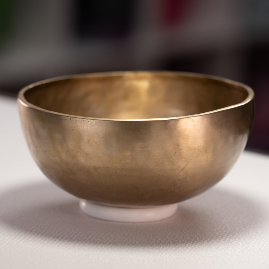 Bronze bowl on a neutral background