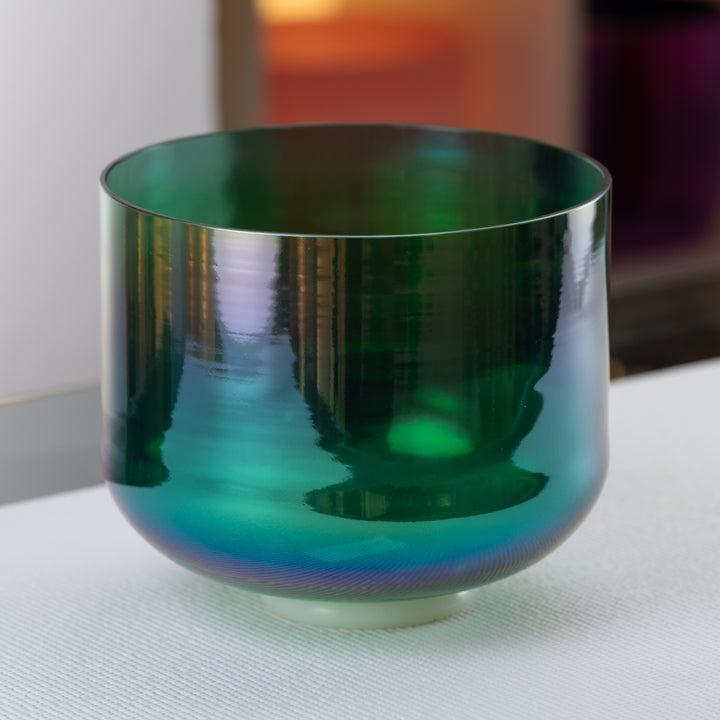 A#-7 Earth Magic Crystal Singing Bowl with a prismatic effect and dark green color, placed on a white surface.