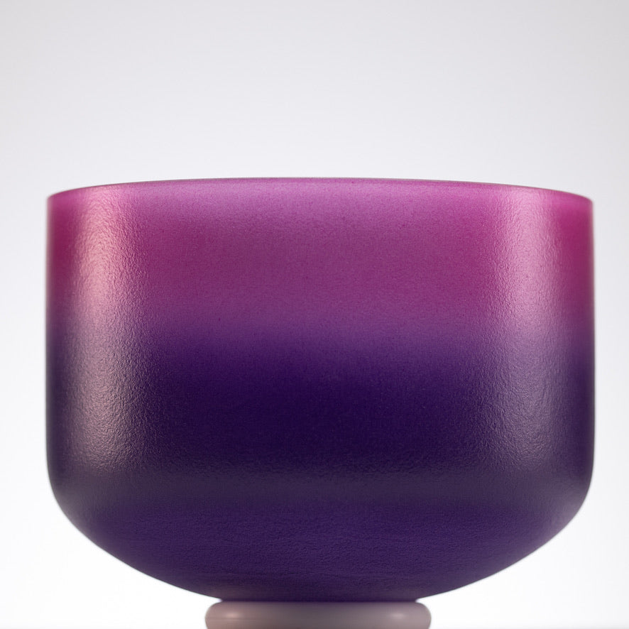 Pink and purple singing bowl for sound healing 