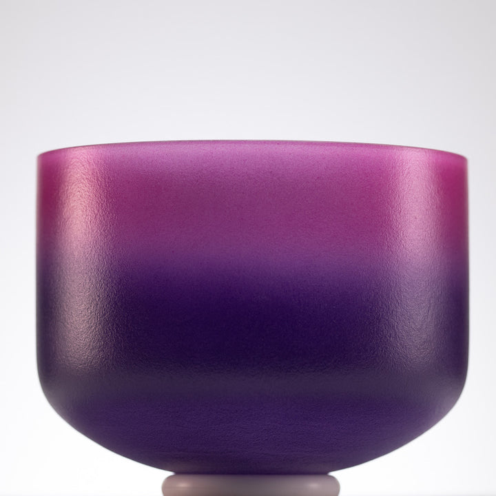 Pink and purple singing bowl for sound healing 