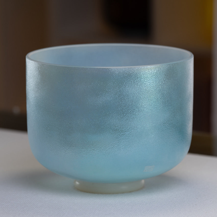 A 10 inch G+40 Aqua Aura Gold Super Grade Crystal Singing Bowl with a glossy finish.