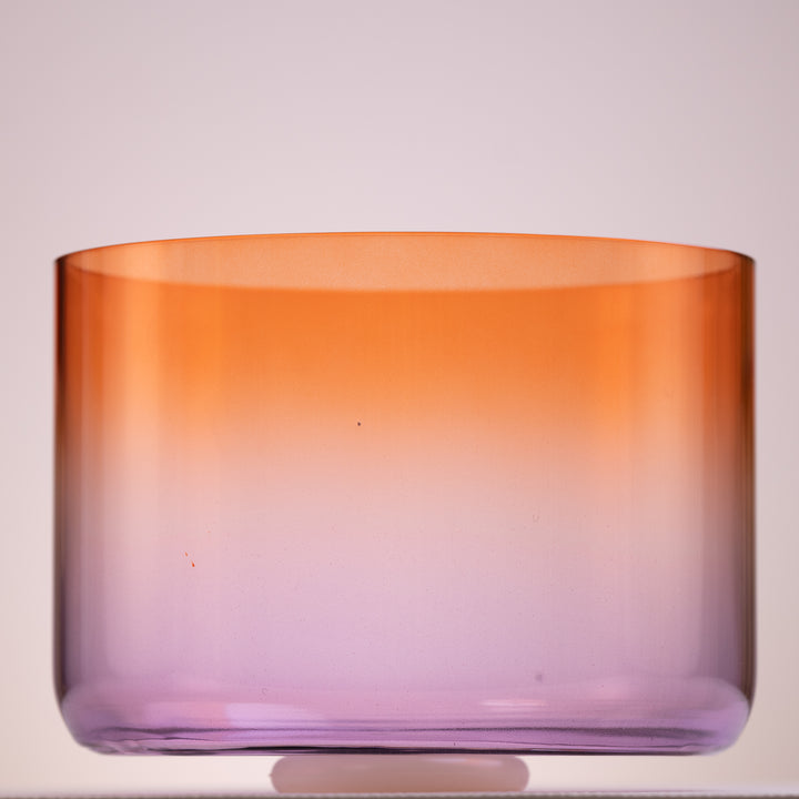 An 11.75 inch A#-30 Sunset Bloom Crystal Symphony Bowl with a gradient color transition from orange to purple.