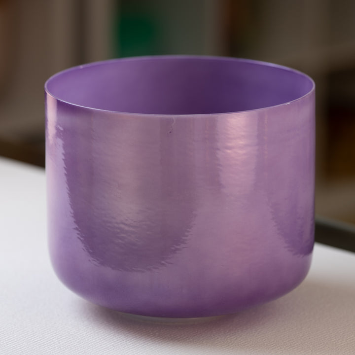 A 11 inch lilac-colored crystal singing bowl with a pearlescent finish. 