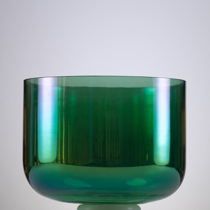 An 11 inch F#+15 Earth Magic Crystal Singing Bowl with a prismatic effect and a dark green color, intended for meditation and sound therapy.