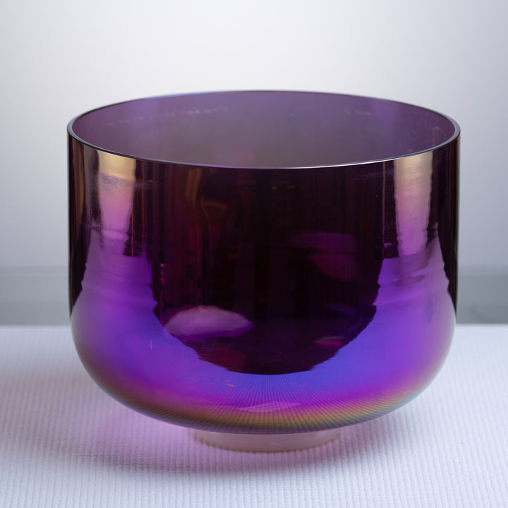 An 11 inch F#+44 Amethyst Activation Crystal Singing Bowl with a deep purple color, displayed on a white surface.