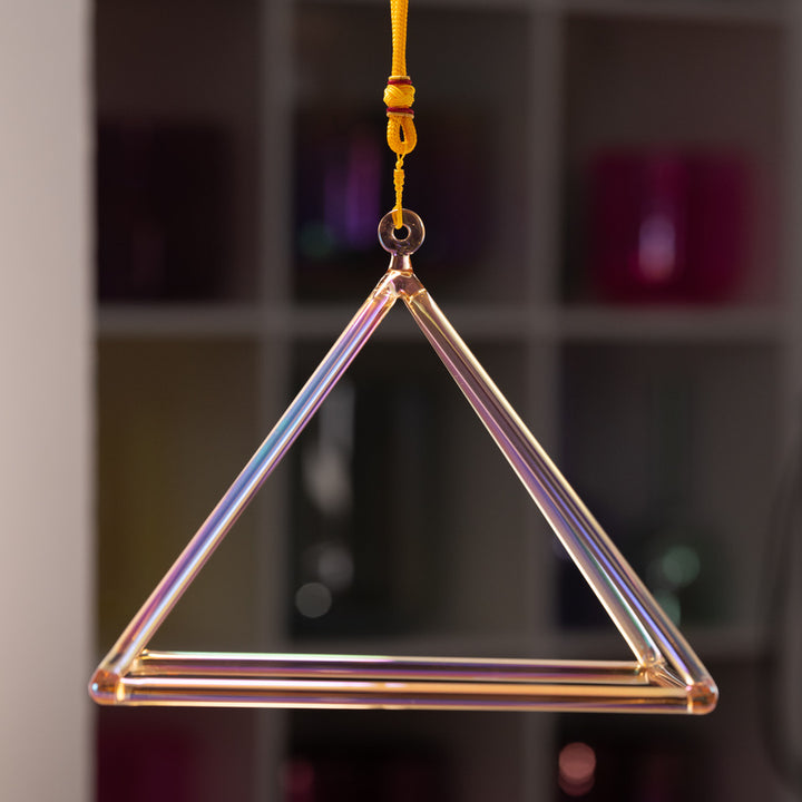 Orange crystal pyramid for sound healing