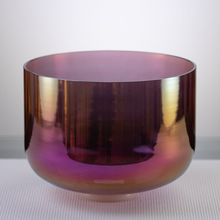 A 12-inch F-11 Healing Violet Flame Crystal Singing Bowl with a prismatic finish, reflecting a range of colors, displayed on a neutral background.