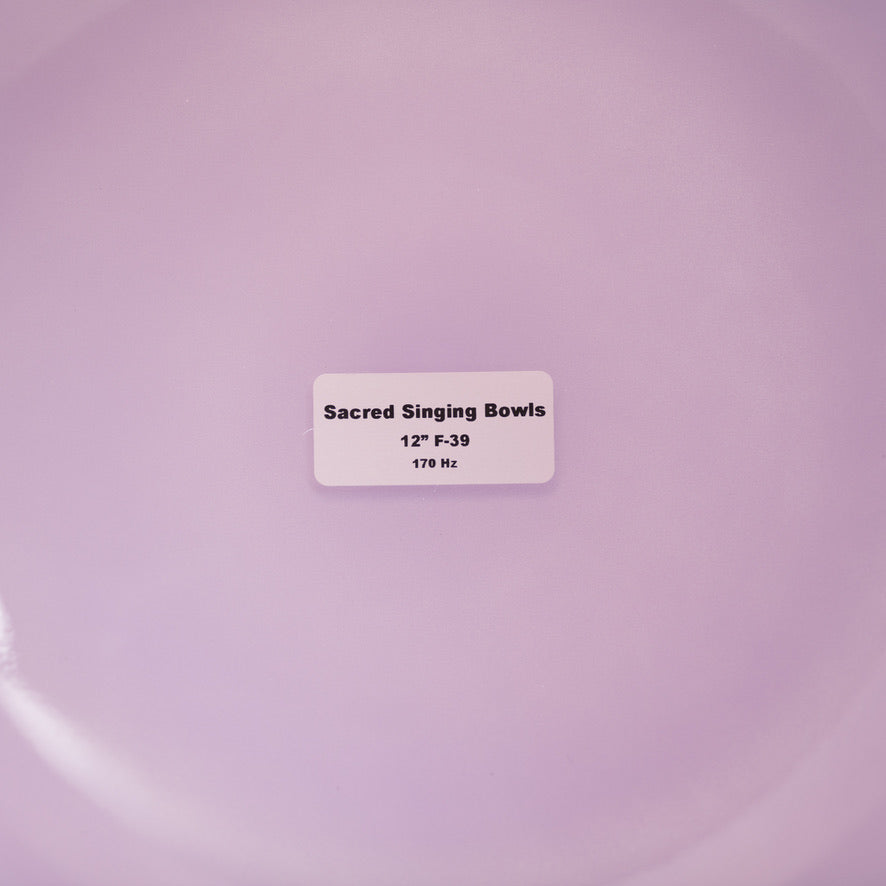 Label on a purple background indicating 'Sacred Singing Bowls' with dimensions and frequency.
