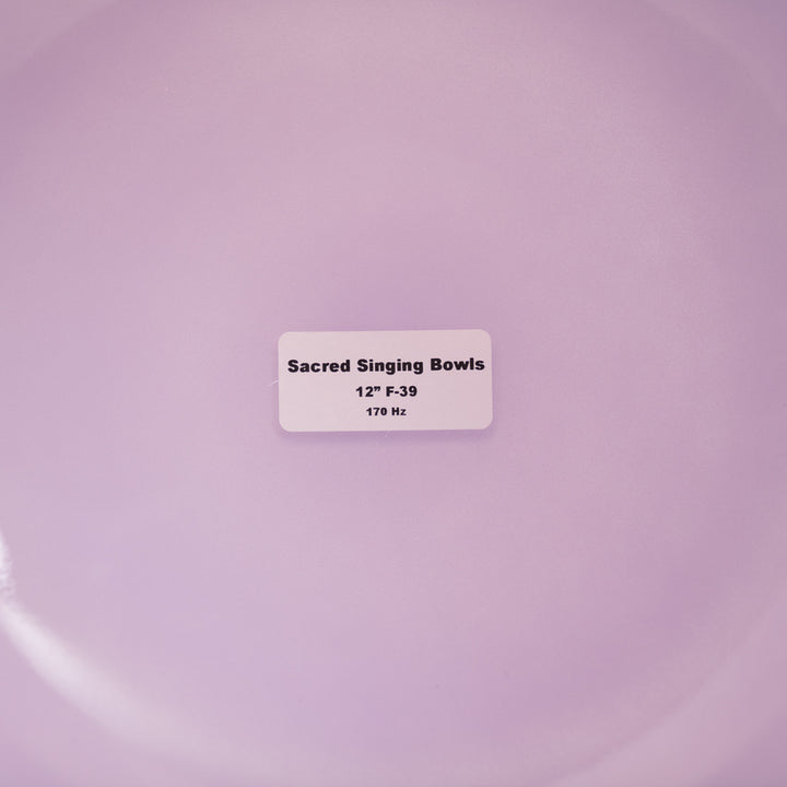 Label on a purple background indicating 'Sacred Singing Bowls' with dimensions and frequency.
