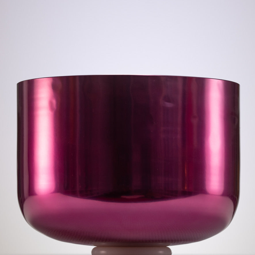 Shiny pink singing bowl on a white background