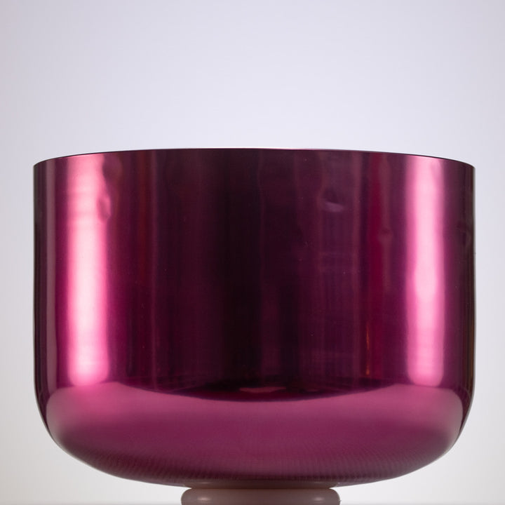Shiny pink singing bowl on a white background