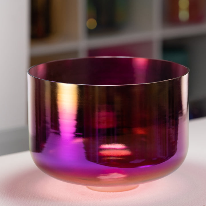 Purple reflective bowl on a white surface with a blurred background