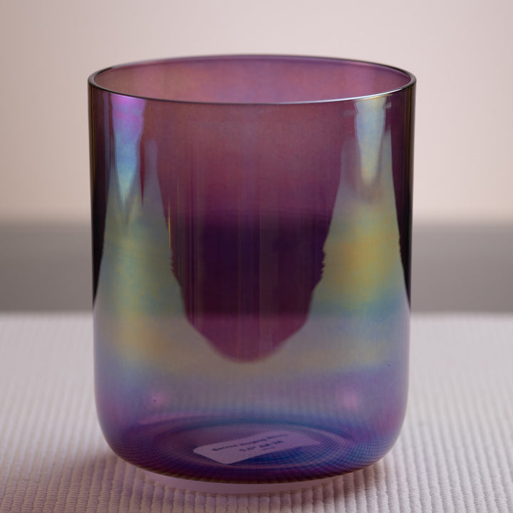A#-38 Amethyst Activation Crystal Singing Bowl, Prismatic, with a dark purple color and a reflective surface, displayed on a white textured surface.