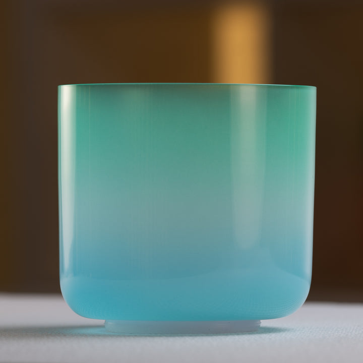 Green and blue throat chakra singing bowl