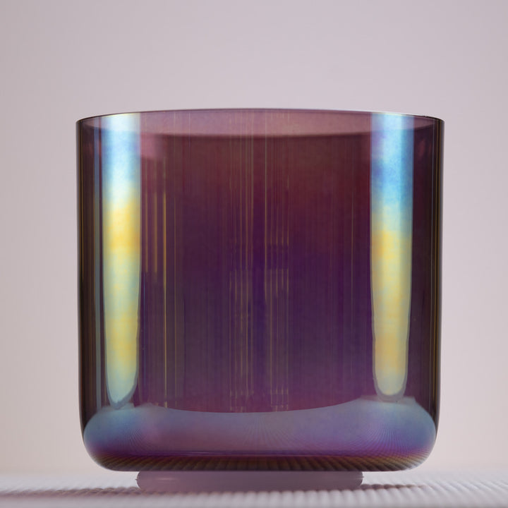 A 5.75" G#-40 Amethyst Activation Crystal Singing Bowl with a prismatic, dark purple hue.