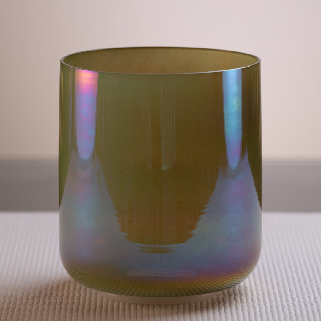 A 6.25 inch F-38 Garden Goddess Crystal Singing Bowl with a prismatic design in green, yellow, and purple colors.