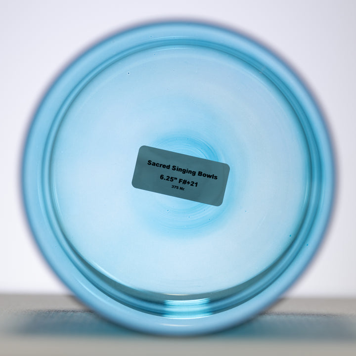 Caribbean Blue Crystal Singing Bowl with a label indicating it is 6.25 inches in diameter and has a frequency of 375 Hz.