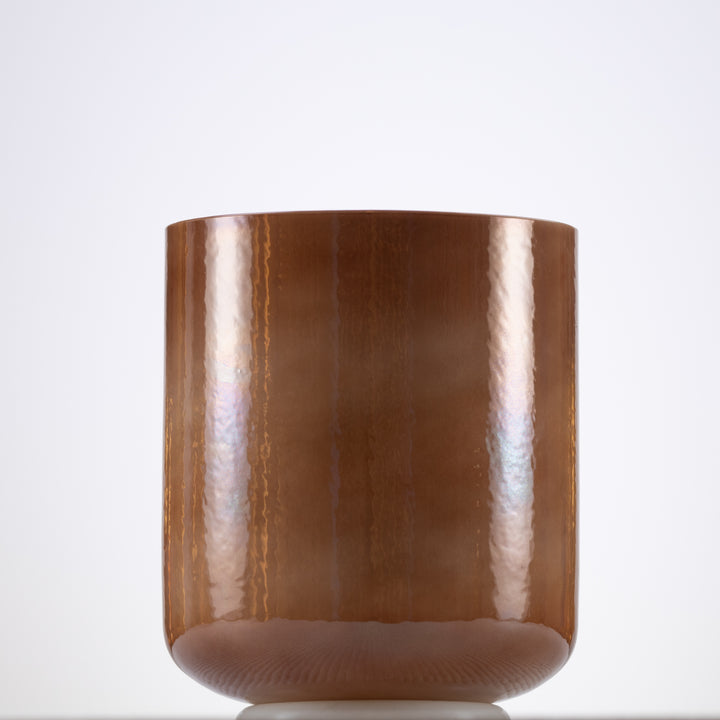 A 6.5 inch F#-43 Desert Hymn Crystal Singing Bowl with a pearlescent, light brown color.