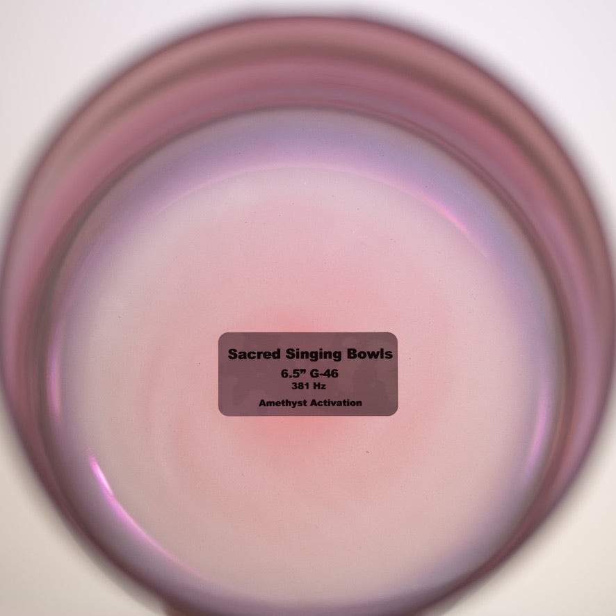 Singing bowl with a label indicating 'Sacred Singing Bowls' and specifications.