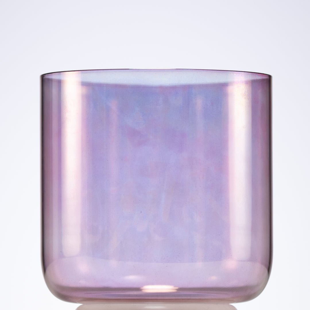 A 6-inch Solar Violet Crystal Singing Bowl with a reflective surface displaying shades of purple and pink.