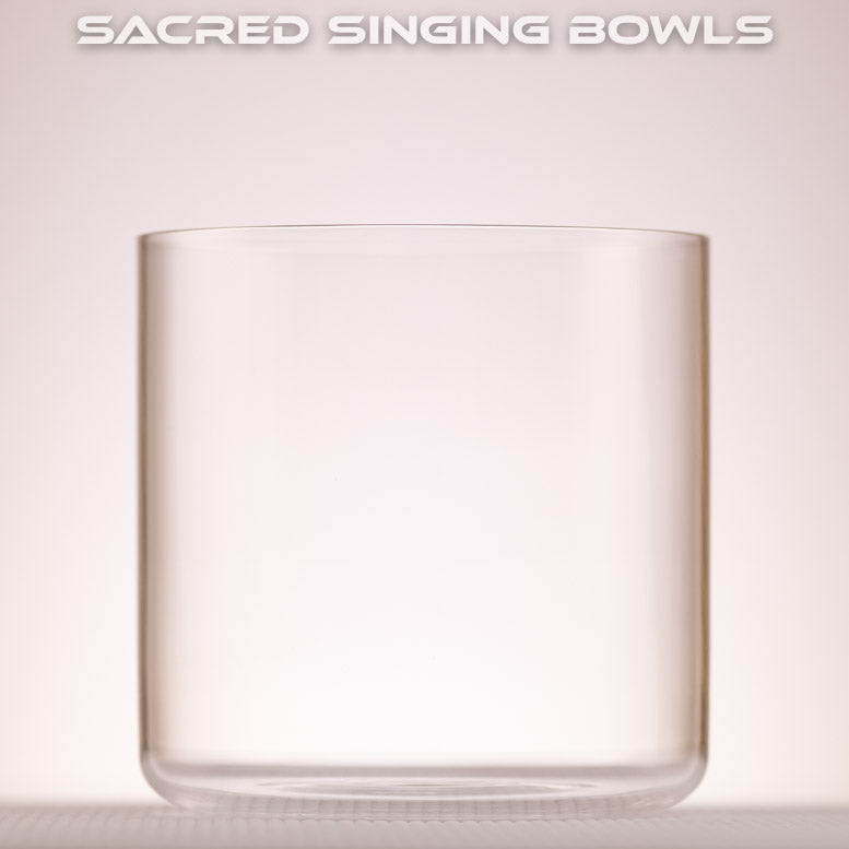 A 6 inch F#-9 Clear Quartz Crystal Singing Bowl, with a label that reads 'SACRED SINGING BOWLS'. 