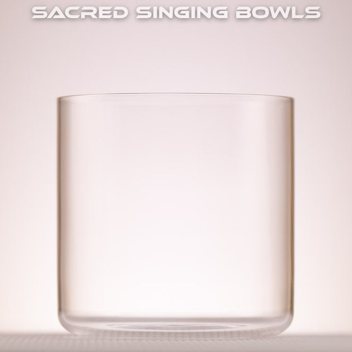 A 6 inch F#-9 Clear Quartz Crystal Singing Bowl, with a label that reads 'SACRED SINGING BOWLS'. 