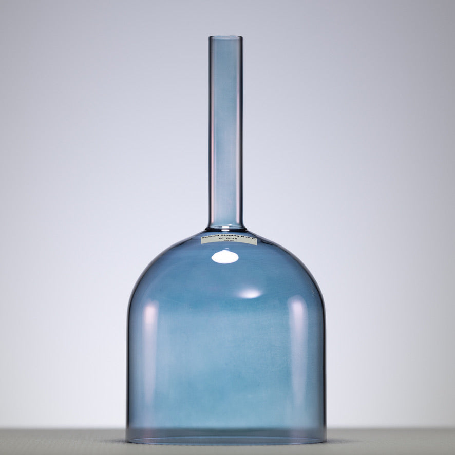 A 6-inch handheld crystal singing bowl with an indigo color and a handle on top.