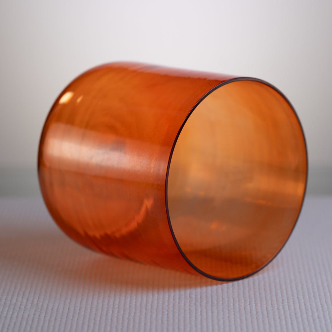 Orange crystal bowl for sound baths