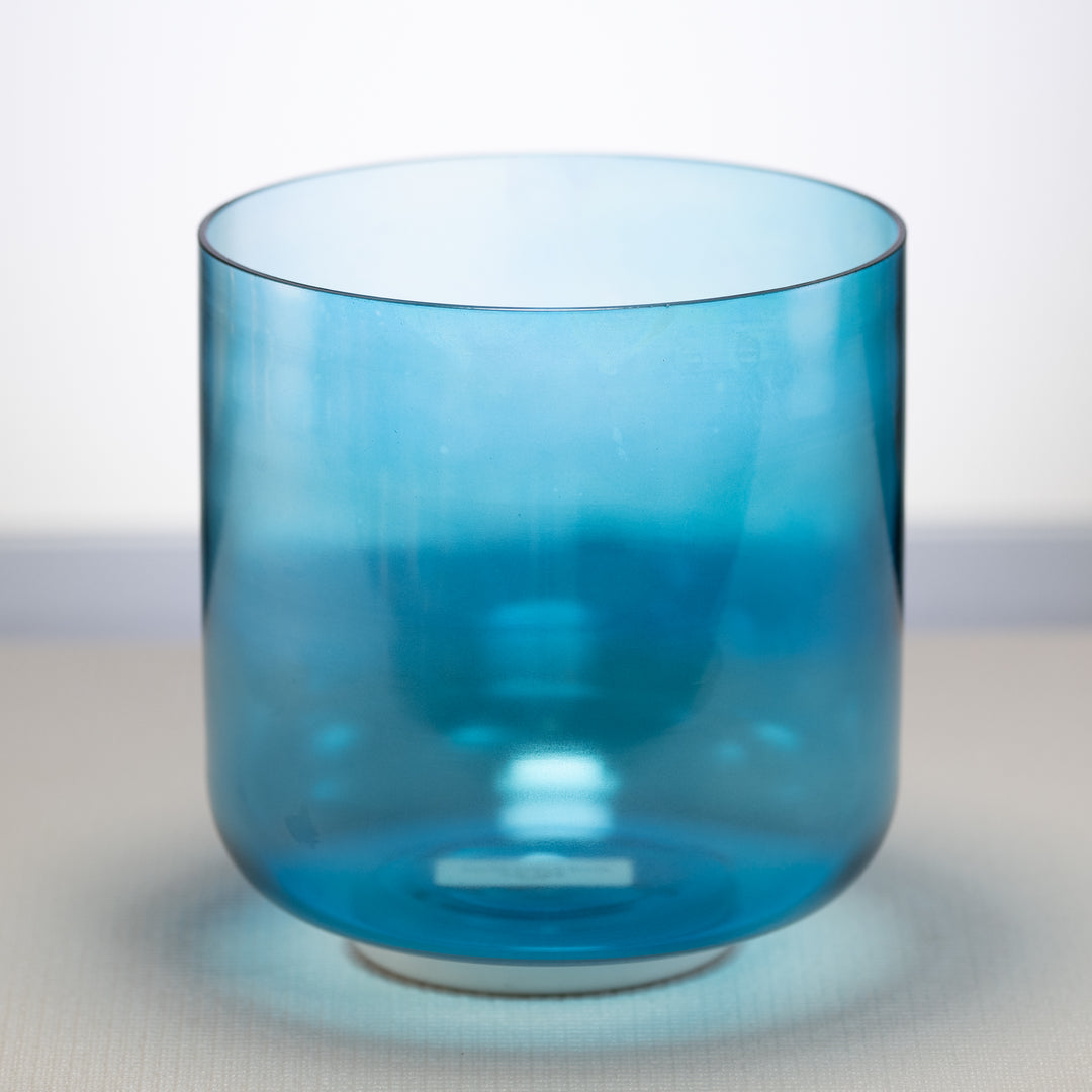A Caribbean Blue Crystal Singing Bowl  placed on a light background.