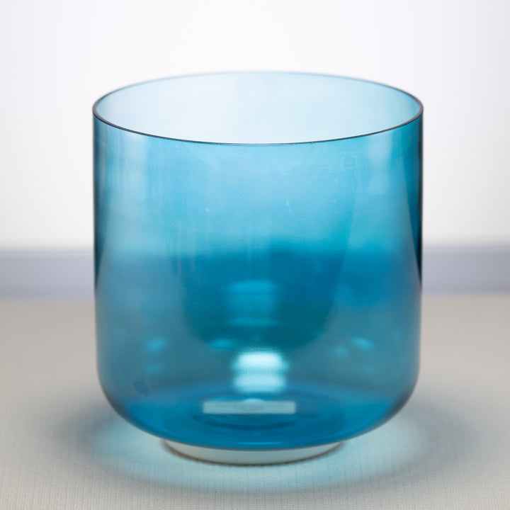 A Caribbean Blue Crystal Singing Bowl  placed on a light background.