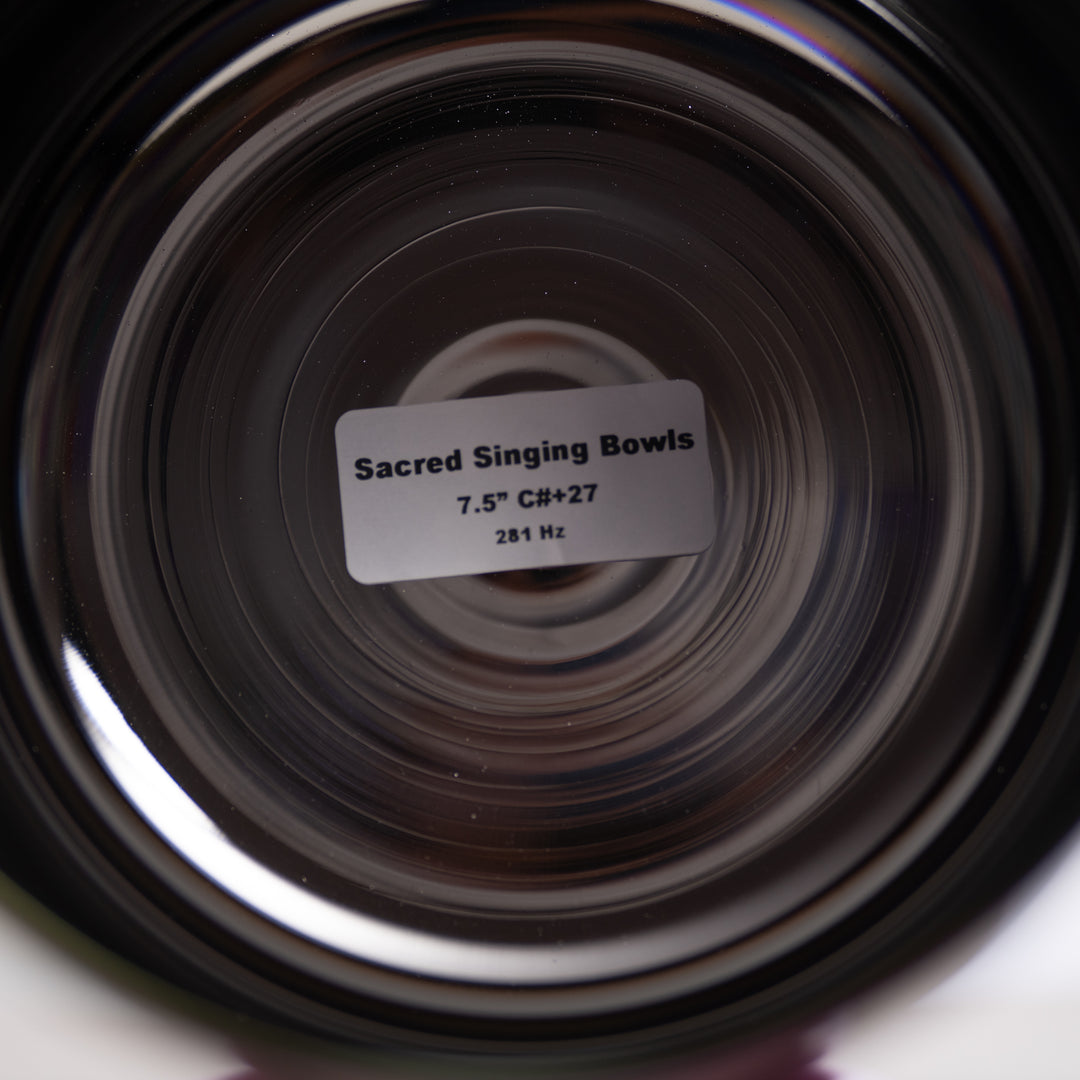 Close-up of a Sacred Singing Bowls label with concentric circular patterns.