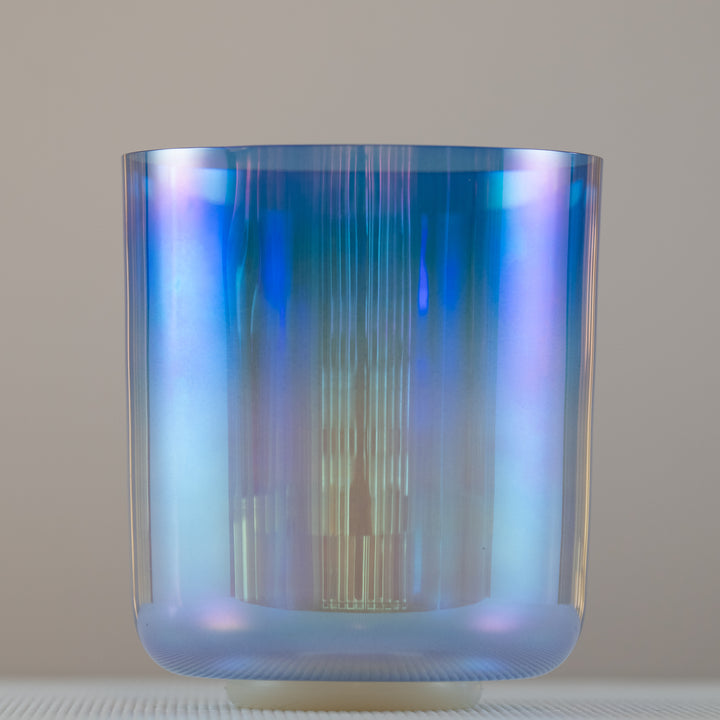 A 8.25" D-5 Indigo Child Crystal Singing Bowl with a prismatic blue and purple color pattern.