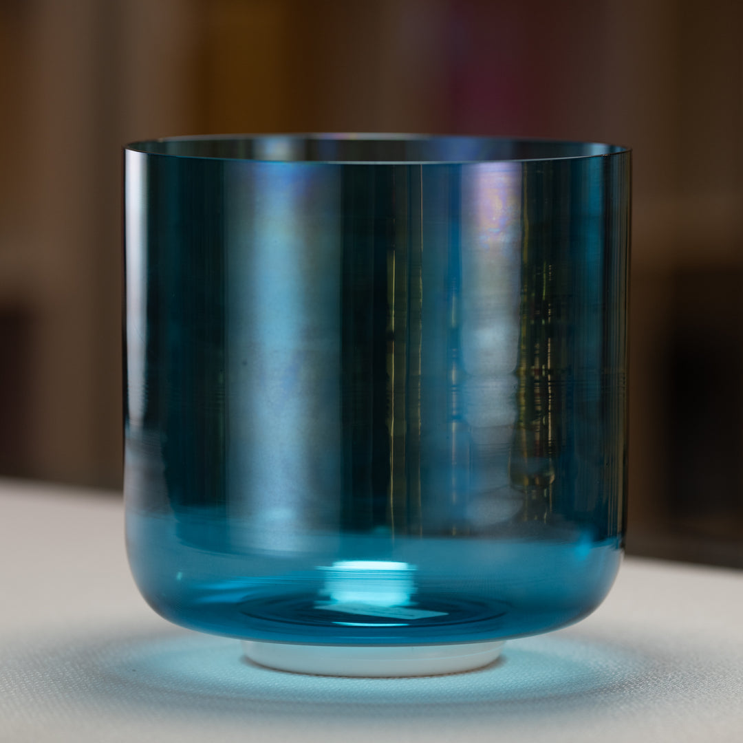 A 8" G#+35 Caribbean Blue Crystal Singing Bowl with a shimmering blue color and a reflective surface.