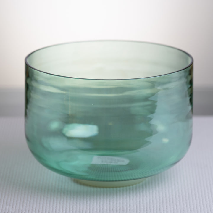 A 9.5 inch green Crystal Singing Bowl with a mallet and carrying case.