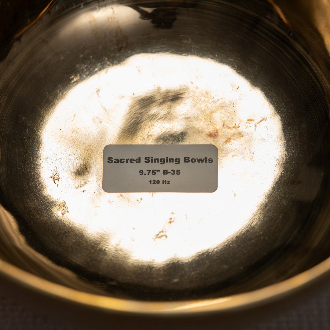 Close-up of a Sacred Singing Bowls™ logo with a label indicating its specifications.