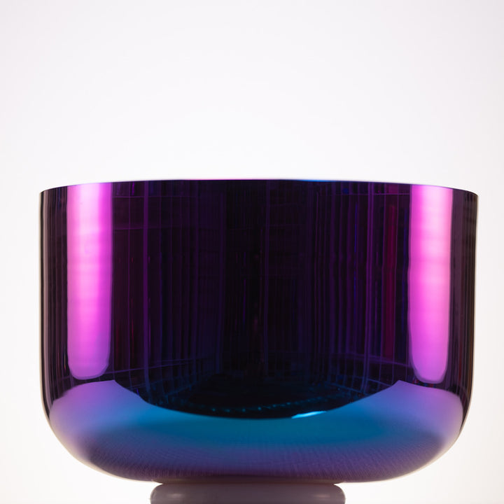 Vibrant purple and blue crystal bowl on a white background