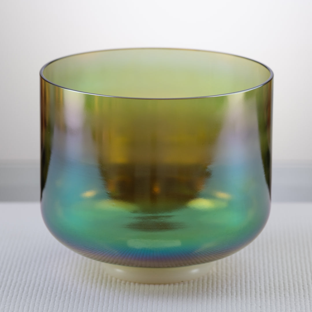 A 9 inch C#-23 Earth Magic Crystal Singing Bowl with a prismatic dark green to yellow color color.