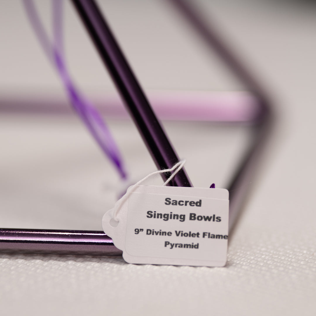 Singing pyramid with a label indicating 'Sacred Singing Bowls 9th Divine Violet Flame Pyramid' on a neutral background.