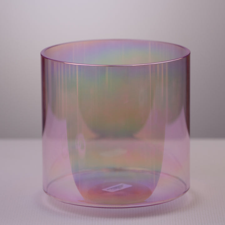 A 10 inch E+18 Solar Violet and Prismatic Crystal Singing Bowl on a white background, reflecting light and color.