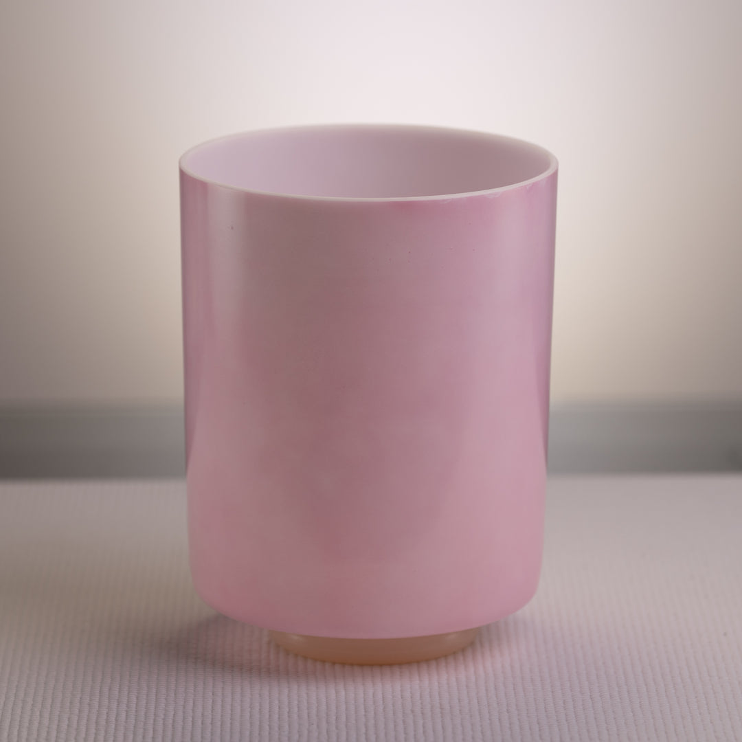 An 8-inch tall pink ocean gold crystal singing bowl on a white background.