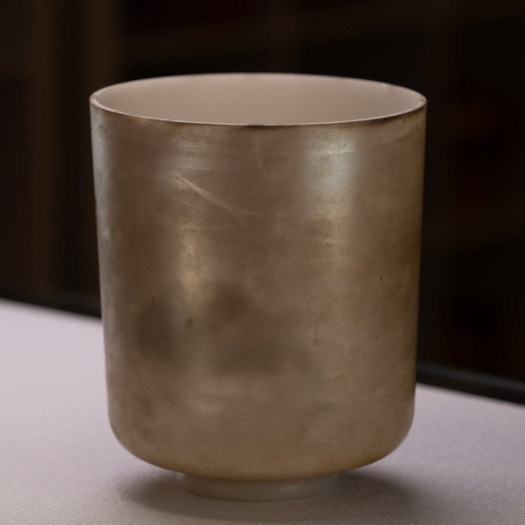 A 9 inch C#+50 Grandfather Super Tall Crystal Singing Bowl with a metallic finish.