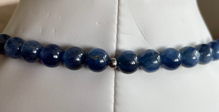 Blue beaded necklace on a mannequin bust